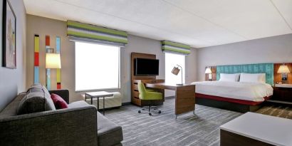 Day use studio suite with work station, lounge area and lounge area at the  Hampton Inn & Suites By Hilton Guelph.