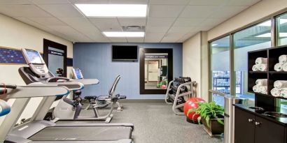 Fully equipped fitness center at the  Hampton Inn & Suites By Hilton Guelph.