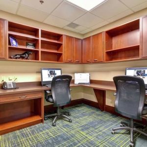 Professional business center with compuerts, printer and ergonomic chairs at the  Hampton Inn & Suites By Hilton Guelph.