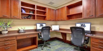 Professional business center with compuerts, printer and ergonomic chairs at the  Hampton Inn & Suites By Hilton Guelph.