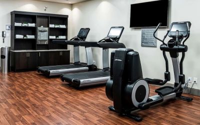 Fitness center with treadmills and machines  at DoubleTree By Hilton Kitchener.