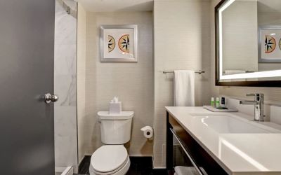 Private guest bathroom with shower and free toiletries at the Four Points By Sheraton St Catharines Niagara Suites. 