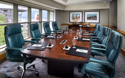 Professional meeting room with large windows and ergonomic chairs at the Fairmont Waterfront.
