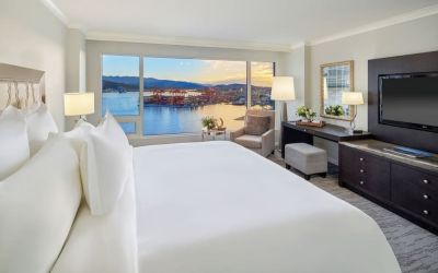 Day use room with TV, work desk, sofa and private bathroom at the Fairmont Waterfront.