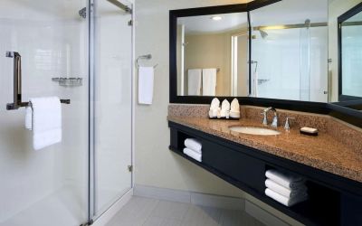 Guest bathroom with shower at Embassy Suites By Hilton LAX Airport North.
