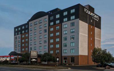 Hotel exterior and parking area at Four Points By Sheraton Toronto Mississauga.