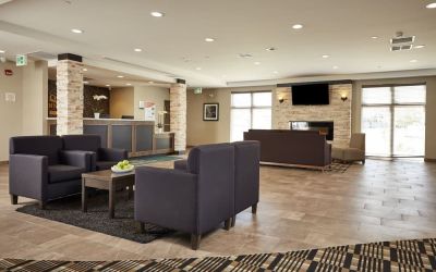 Hotel lobby with lounge area at Quality Inn & Suites Kingston.