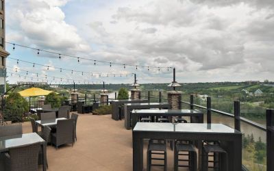 Hotel terrace with beautiful view and comfortable seating at Courtyard By Marriott Edmonton Downtown.