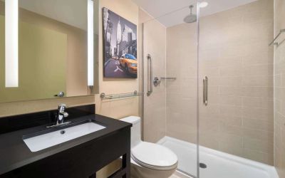 Guest bathroom with shower at Best Western Premier Herald Square.