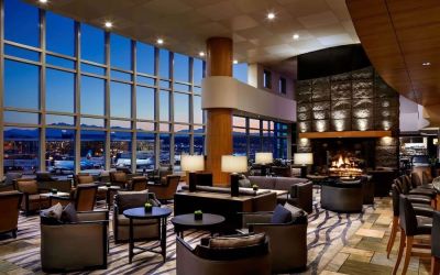 Hotel bar lounge area with fireplace at Fairmont Vancouver Airport - YVR Terminal Hotel.