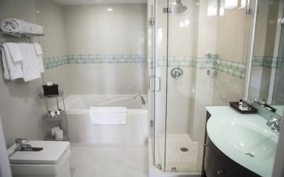 Guest bathroom with shower and tub at The Mutiny Hotel.