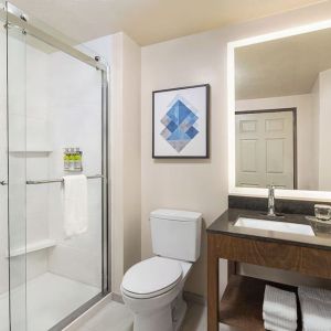 Guest bathroom with shower at Candlewood Suites Boise.