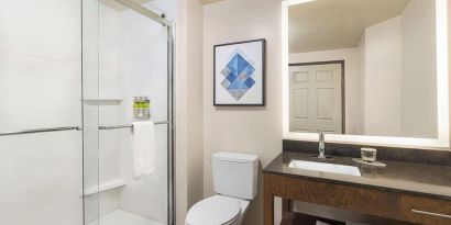 Guest bathroom with shower at Candlewood Suites Boise.