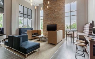 Lobby and coworking lounge at Cambria Suites Denver Airport.