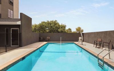 Refreshing outdoor pool at La Quinta Inn & Suites - North Stone Oak.