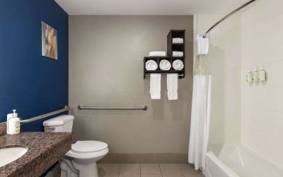 Guest bathroom with shower and tub at La Quinta Inn & Suites - North Stone Oak.
