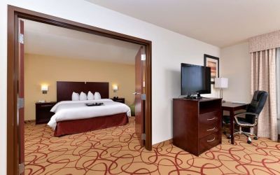 Day use room with living area and work desk at Hampton Inn Deer Park.