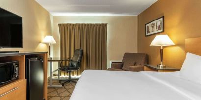 Day use room with TV, sofa, work desk and private bathroom at Comfort Inn Pickering.