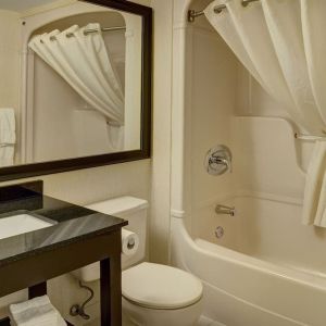 Guest bathroom with tub at Comfort Inn Pickering.