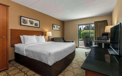 Standard day use room with TV, work desk, sofa and private bathroom at Comfort Inn New Glasgow.