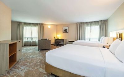 Bright and spacious day use twin room with work desk at Comfort Inn Kingston HWY 401. 