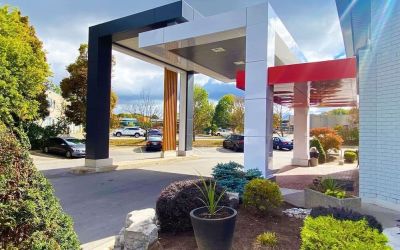 Hotel entrance and parking area at Comfort Inn Dryden.
