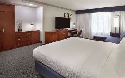 Bright and spacious day use room with TV, work desk, sofa and private bathroom at Courtyard By Marriott Waterloo St. Jacobs.
