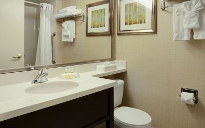 Guest bathroom with showers and free toiletries at Holiday Inn Conference Center Edmonton South.
