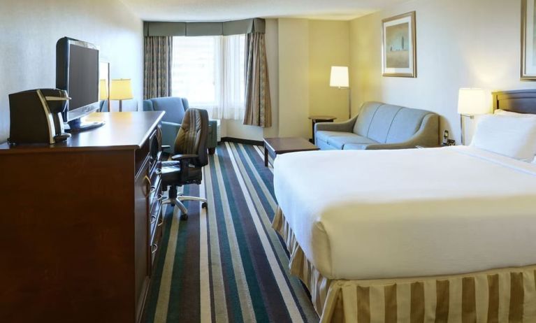 Bright day use room with living area and workspace at Holiday Inn Conference Center Edmonton South.