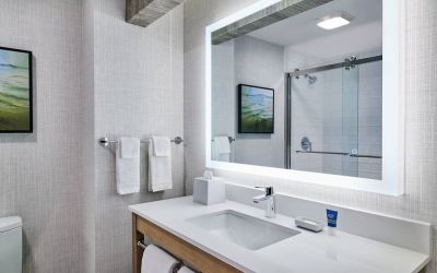 Guest bathroom with shower at Four Points By Sheraton Salt Lake City Airport.