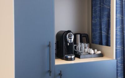 Day room with coffee station at Spark By Hilton Luton.