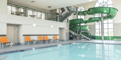 Indoor pool with water slide at Holiday Inn Express & Suites Medicine Hat.