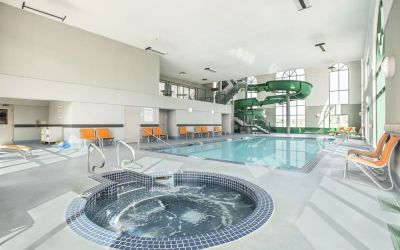 Indoor pool, jacuzzi and water slide at Holiday Inn Express & Suites Medicine Hat.