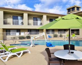 Sun loungers beside the pool at Spark By Hilton Fountain Hills Scottsdale.