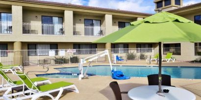 Sun loungers beside the pool at Spark By Hilton Fountain Hills Scottsdale.