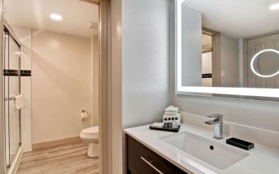 Guest bathroom with shower and free toiletries at The Park Hotel London.