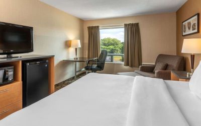 Standard day use room with TV, work desk and sofa at Comfort Inn Pembroke.