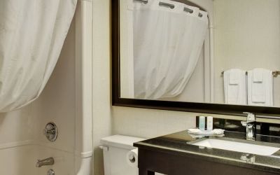 Guest bathroom with tub and free toiletries at Comfort Inn Pembroke.
