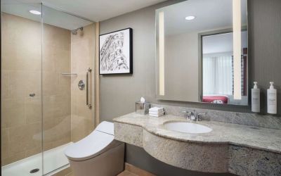 Guest bathroom with shower at Hilton Garden Inn New York/West 35th Street.