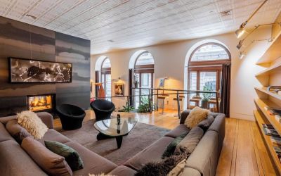 Lobby lounge with fireplace and workspace at Hotel Gault.