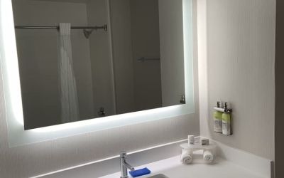 Guest bathroom with shower at Holiday Inn Express & Suites Hermosa Beach.