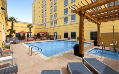 Refreshing outdoor pool and spa tub at La Quinta Inn & Suites San Antonio Medical Center NW.