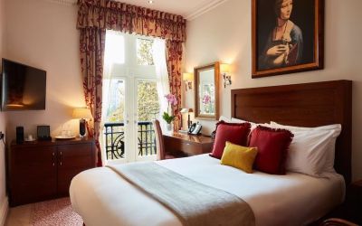 Day room with work desk and TV at The Royal Horseguards Hotel.