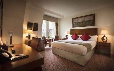 Day use room with work desk and lounge sitting at The Royal Horseguards Hotel.