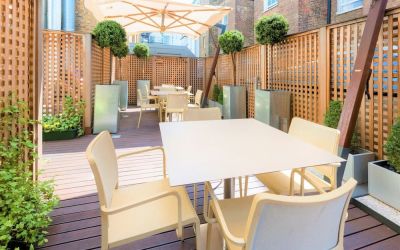 Outdoor patio with sitting area perfect for co-working at Hotel Indigo London Paddington,