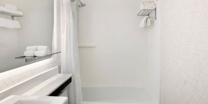 Guest bathroom with shower and tub at Holiday Inn Express New York City - Chelsea.