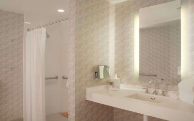 Guest bathroom with shower at Hyatt Regency Los Angeles International Airport.