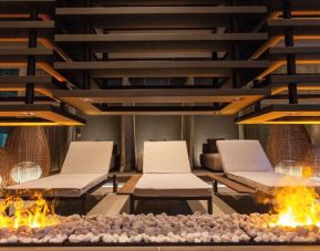 Lounge chairs and fire pit at Keight Hotel Opatija.