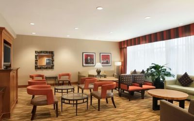 Lounge seating at Hampton Inn New York - LaGuardia Airport.