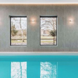 Indoor pool area at Graduate By Hilton Cambridge.